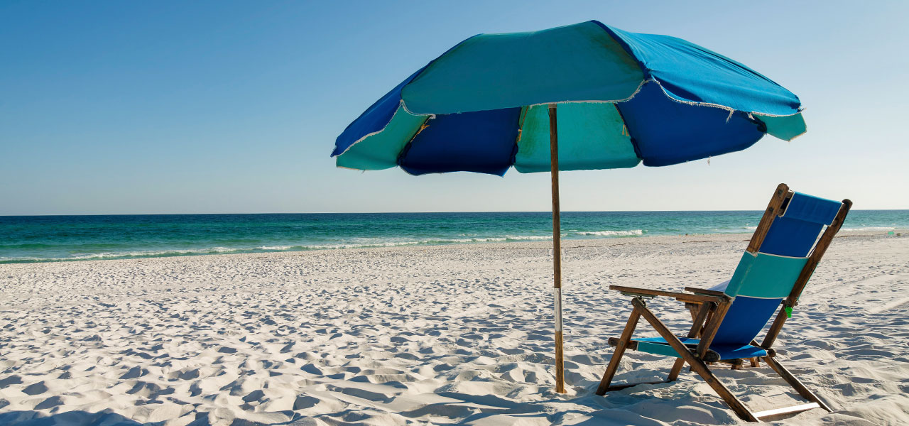 Destin beach with the umbrella and beach chair